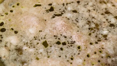 A broth that boils in detail when cooked in saucepan.Close-up.Soup, jellied meat Stock Footage 153182453