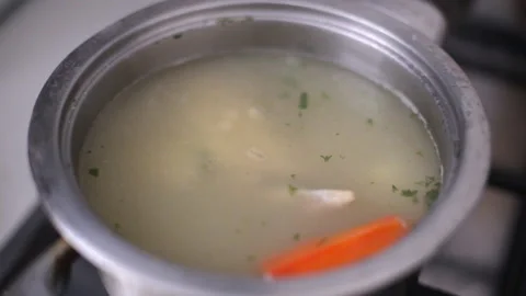 Broth of chicken cooked in a saucepan Video stock 121503891