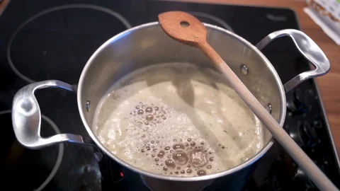 Broth is cooking in a saucepan Stock Footage 124678357