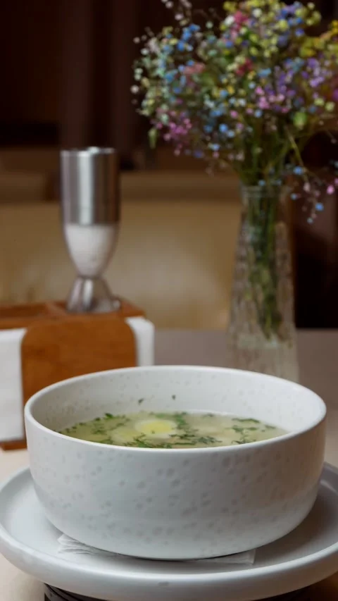 Broth with noodles and egg in a plate rotating Stock Footage 308745813