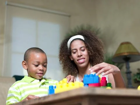 Brother and sister playing with Legos Stock Photos