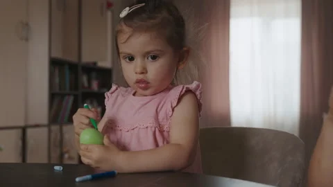 Brother and sister preparing for Easte drawing on decorative eggs. Home classes Video stock 246648957