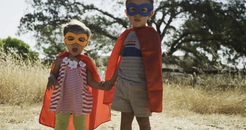 Brother and sister pretending to be superheros Stock Footage 95434053