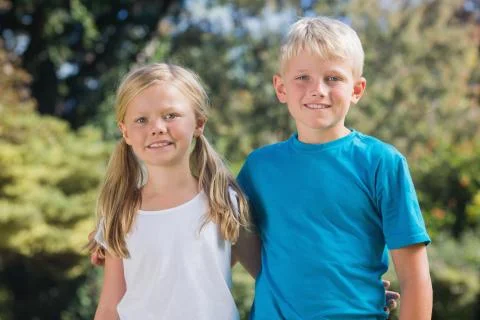 Brother and sister smiling at camera Stock Photos