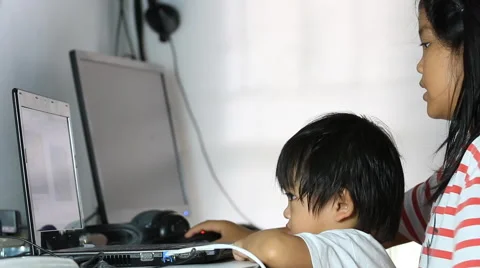 Brother and sister watching computer Stock Footage 40052557