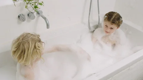 Brother Splashing Sister With Soap Suds ... | Stock Video 