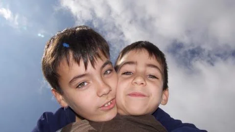 Brothers on the beach Stock Photos