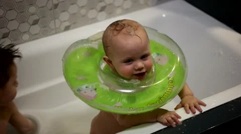Brothers Playing in Bath With Bubbles Stock Footage 61004300