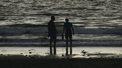 Brothers sanding at the beach Stock Footage 126669341