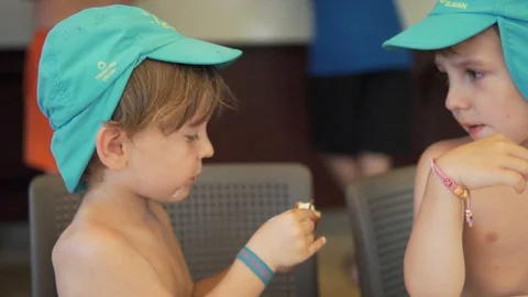 Brothers sharing the ice cream Stock Footage 113457845