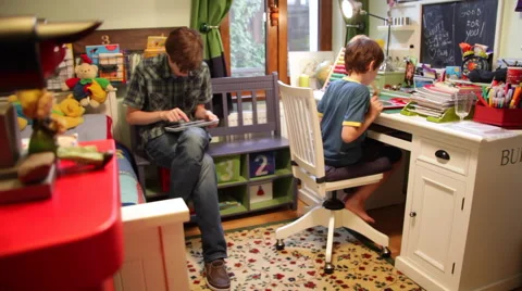 Brothers with tablet computer, playing video games, using iPad, Internet Stock Footage 43117450
