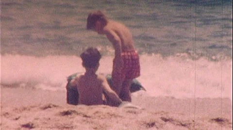 Brothers Young BOYS PLAYING BEACH Sand W... | Stock Video