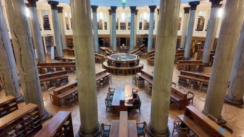 Brotherton Library - Student studying inside the University of Leeds reading Video stock 338217579