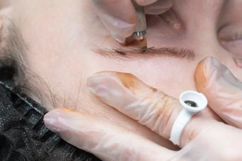 Brow master, eyebrow tattoo close-up Stock Photos