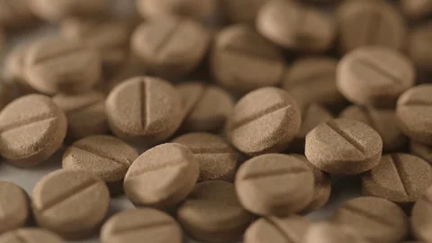 Browm pills on Turntable Stock Footage 250083559