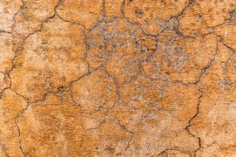 Brown adobe clay wall texture background. Stock Photos