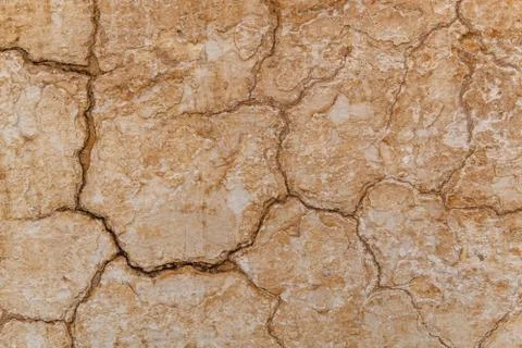 Brown adobe clay wall texture background. Stock Photos