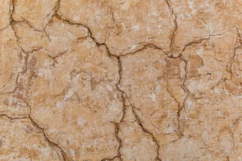 Brown adobe clay wall texture background. Stock Photos