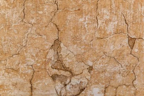 Brown adobe clay wall texture background. Stock Photos
