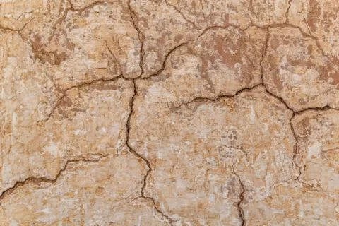 Brown adobe clay wall texture background. Stock Photos