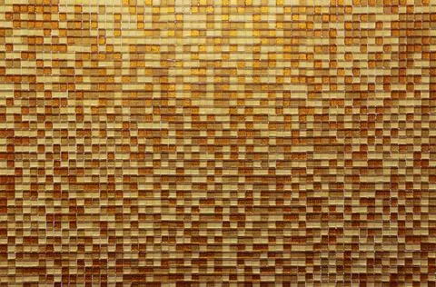 Brown and beige mosaic on the wall Stock Photos