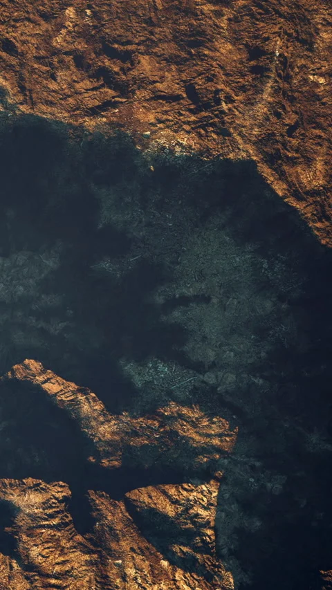 Brown and black patterns on a rocky surface in natural light Stock Footage 345009677