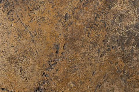 A brown and tan surface with a rough texture. Stock Photos