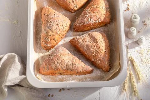 Brown and tasty triangular rolls made of sourdough and flour. Stock Photos