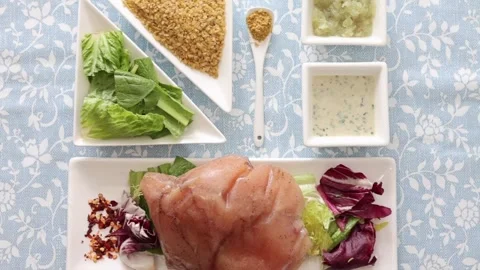 Brown and white Easter eggs decorated in the form of unicorns on a green and Stock Footage 149753496