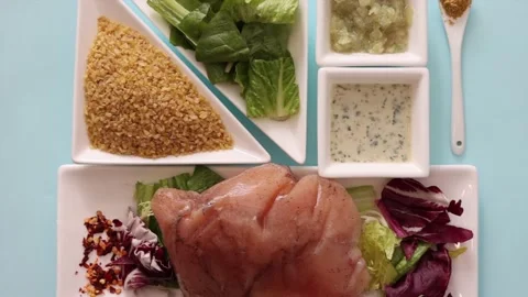 Brown and white Easter eggs decorated in the form of unicorns on a green and Stock-Footage 149754989