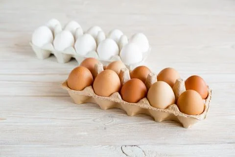 Brown and white eggs Stock Photos