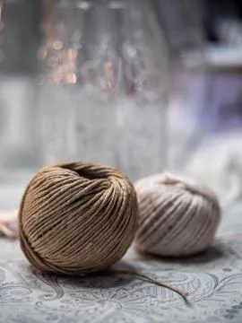 Brown and white thread balls on the table Stock Photos