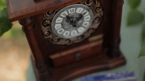 Brown antique clock on the table forest 01 Stock Footage 36517901