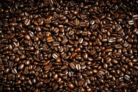 Brown background from coffee grains close up Stock Photos