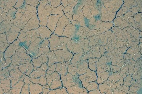 Brown background in cracks. Stock Photos