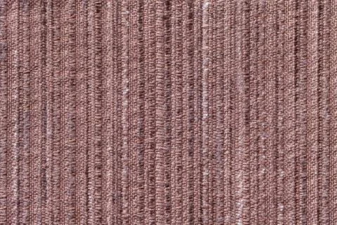 Brown background of a knitted textile material. Fabric with a striped texture Foto stock