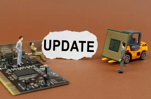 On a brown background, a loader, a processor, a microcircuit, figures of peop 스톡 사진