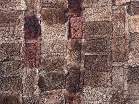 Brown background of rectangles of various sizes and shades, fur texture. Foto stock