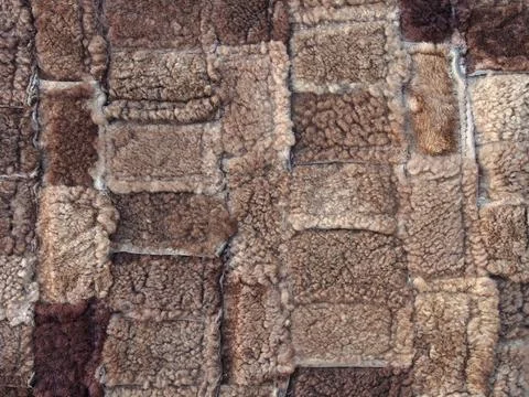 Brown background of rectangles of various sizes and shades, fur texture. Stockfoto's