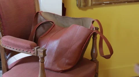 Brown bag on a chair Stock Footage 52856015