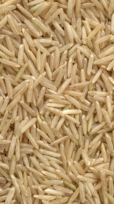 Brown basmati rice background texture.  Vertical video. Stock Footage 297899305