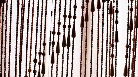 Brown Beaded Curtain Room Divider With Hanging Wooden Beads And Retro Strands 库存影片 340632012