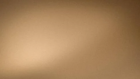 Brown beige gold grainy gradient abstract background blur wallpaper texture.. Stock Photos