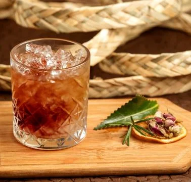 Brown beverage with ice on the table Stock Photos