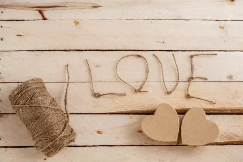 Brown biodegradable gift box in heart shape with thread wrapping,lettering lo Stock Photos
