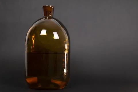 Brown Bottle On A Dark Background Stock Photos