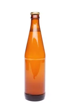 A brown bottle with drink on white background. Stock Photos