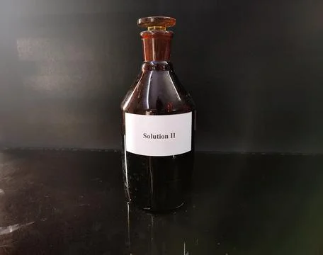 Brown bottle filled with reagent solution 1 Stock Photos