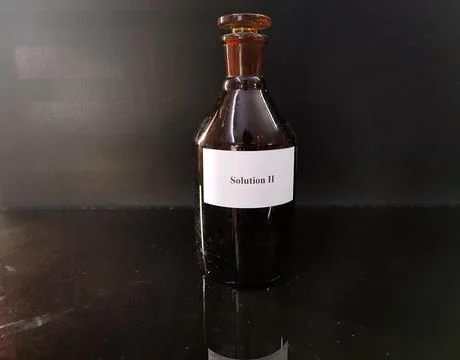 Brown bottle filled with reagent solution 3 Stock Photos