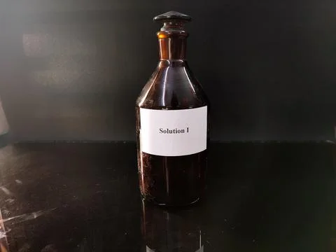 Brown bottle filled with reagent solution 4 Foto stock